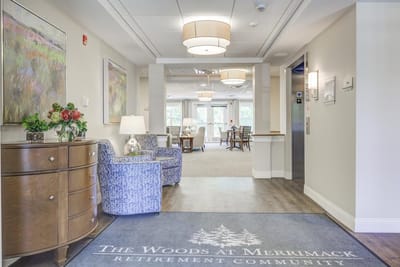 Bright lobby area with seating and floral decor