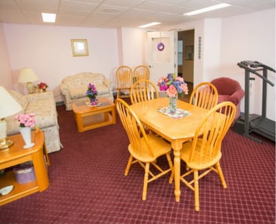 Bright common area with comfortable furniture and decor