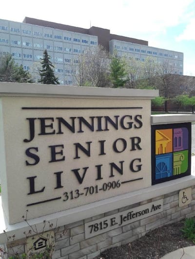 Facility logo sign with contact information
