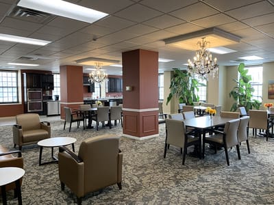 A well-lit common area with seating and decor