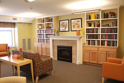 Cozy common area with bookshelves and seating