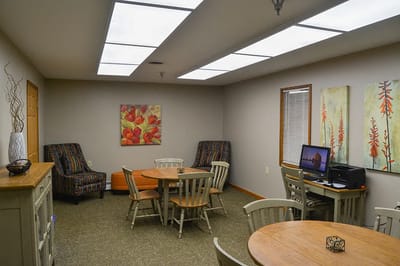 Bright common area with tables and chairs