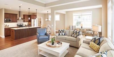 Bright common area with comfortable seating and kitchen space