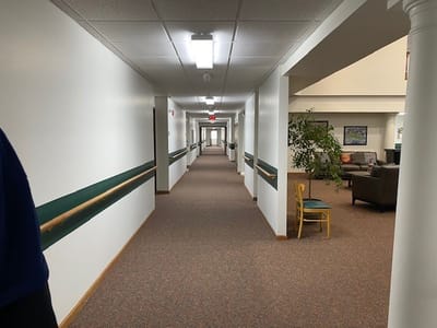 Interior hallway of the facility with seating area