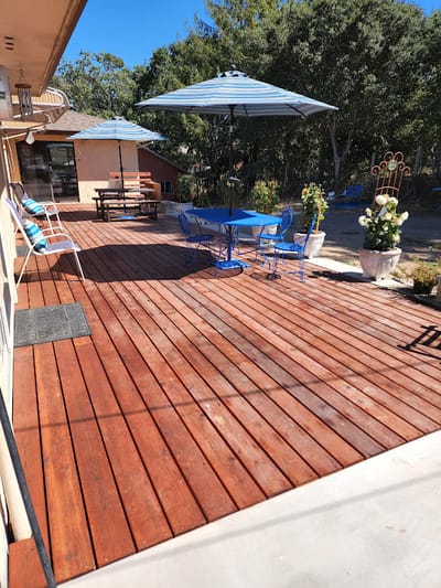 Outdoor patio area with seating and umbrellas