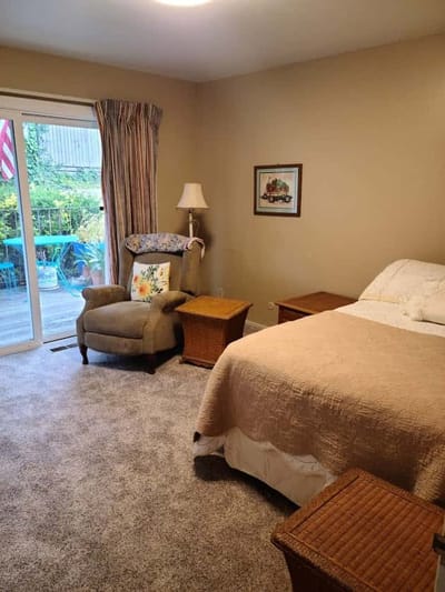 Cozy resident room with a chair and bed