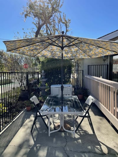 Outdoor seating area with an umbrella on a sunny day