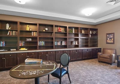 Common area with bookshelves and puzzle table