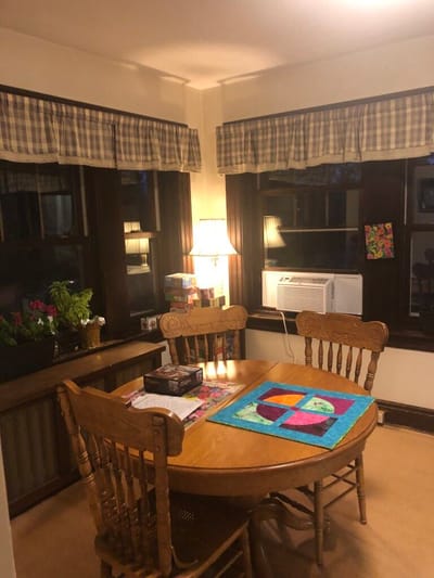 Cozy dining area with wooden table and colorful decor