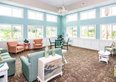 Bright common area with comfortable seating and large windows