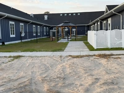 View of the outdoor courtyard with gazebo and fencing