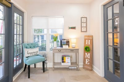 Bright lobby area with decor and welcoming signs