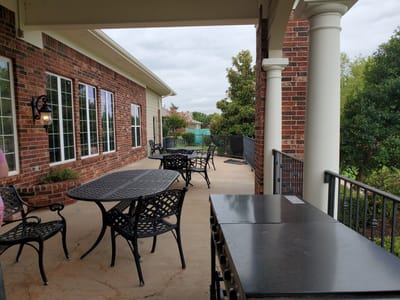 Outdoor patio with tables and chairs