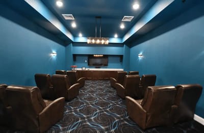 Interior seating area with a large screen