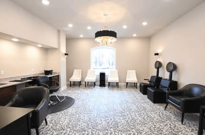Bright salon area with stylish chairs and décor