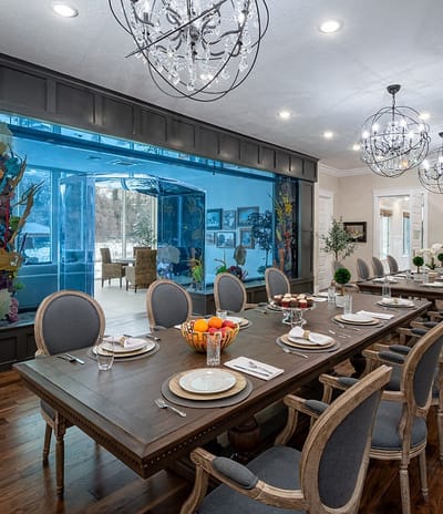 Elegant dining area with a long table set for a meal