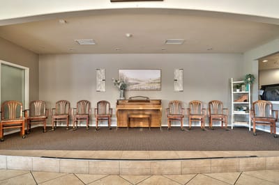 Common area with chairs and a piano