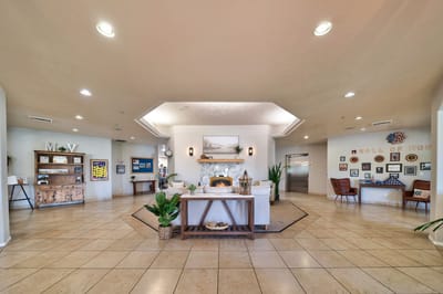 Spacious lobby area with comfortable seating and decor