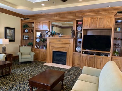 Cozy lounge area with seating and a fireplace