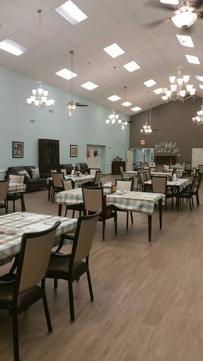 Dining area with tables and chairs set up for residents