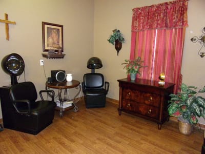 Interior salon area with styling chairs and decor