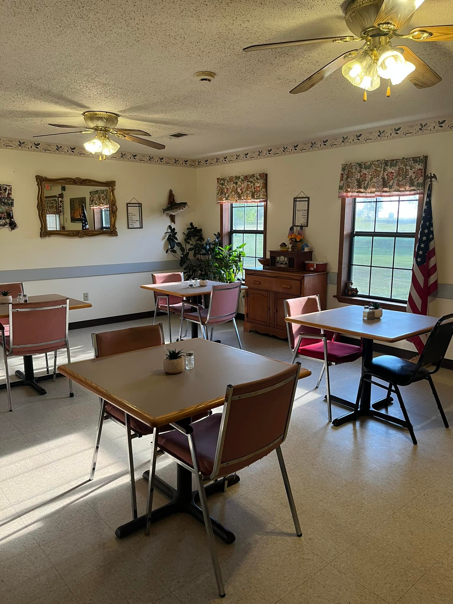 Dining room with tables and an American flag