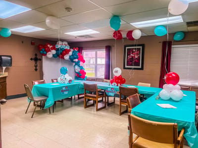 Decorated room for a celebration with balloons and tables