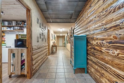 A hallway with wooden walls and decorations
