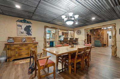 Bright common area with dining table and chairs