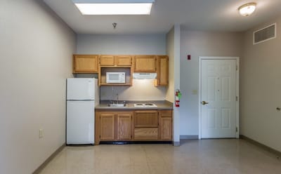 Interior view of a small kitchenette in a living unit