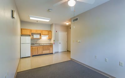 Interior view of a resident room with kitchenette