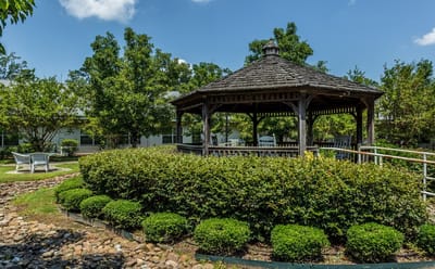 Outdoor gazebo in a landscaped garden area