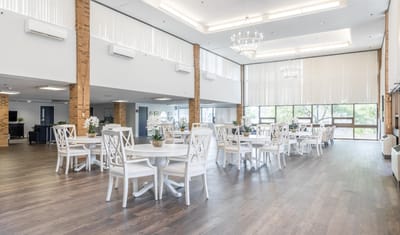 Bright common area with tables and chairs