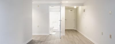 Bright, empty interior space with light-colored floor