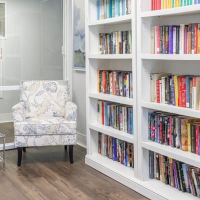 Cozy reading nook with bookshelves and a chair