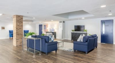 Bright common area with seating and television