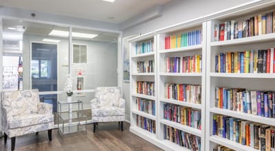Lounge area with bookshelves and seating