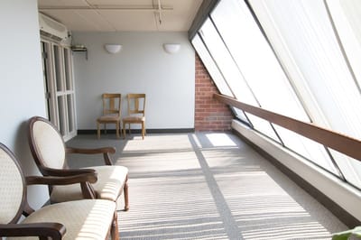 Bright indoor common area with chairs.