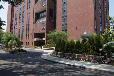 Exterior view of Silsbee Tower with landscaped entrance