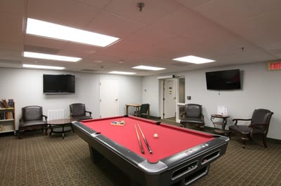 Interior common area with a pool table and seating