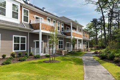 Exterior view of a senior living facility with landscaped grounds