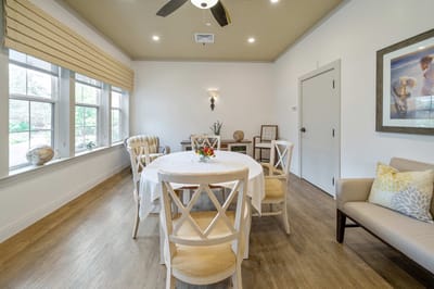 Bright common area with a table and chairs