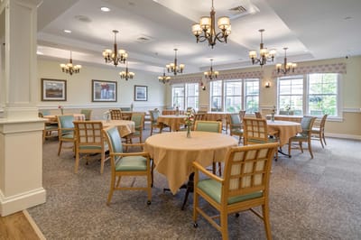 Interior view of a dining room with tables and chairs
