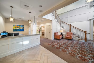Bright lobby area with staircase and seating
