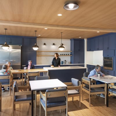 Residents enjoying a meal in a modern dining area