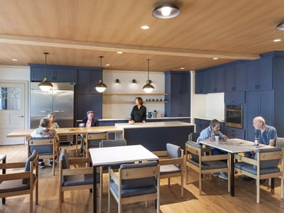 Residents enjoying time in a communal kitchen area