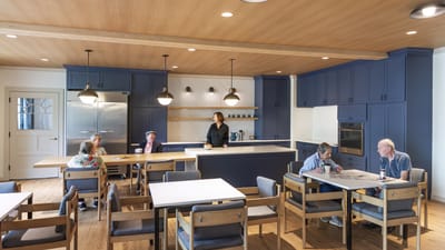 Residents enjoying a meal in a modern dining area