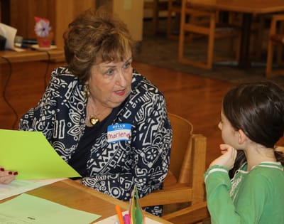 A resident named Marlene interacting with a young girl