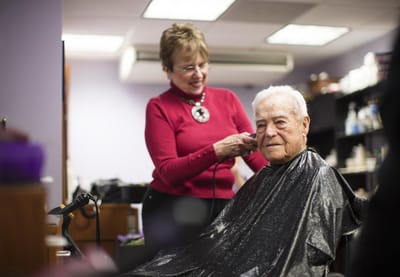 Resident getting a haircut in the salon