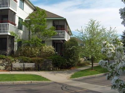 Exterior view of a senior living facility with landscaping